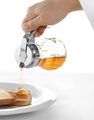 Stijlvolle glazen honingdispenser voor het ontbijtbuffet